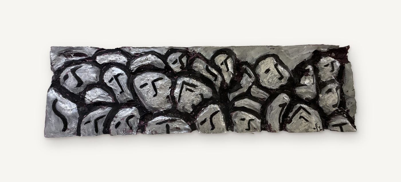 Heads: a long horizontal relief panel crowded with small silver faces outlined in black