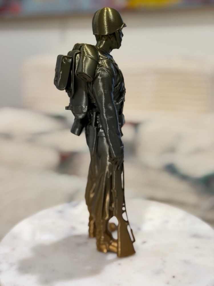 Standing Orders: female soldier at ease, rifle shouldered, bronze and gunmetal print