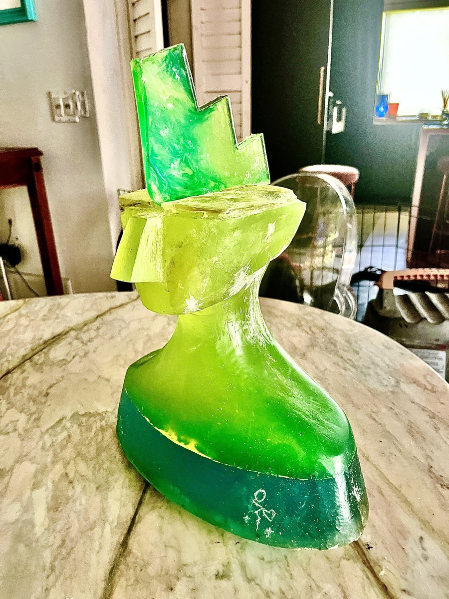Neon Warrior: a translucent neon-green to teal resin head with geometric fins on top